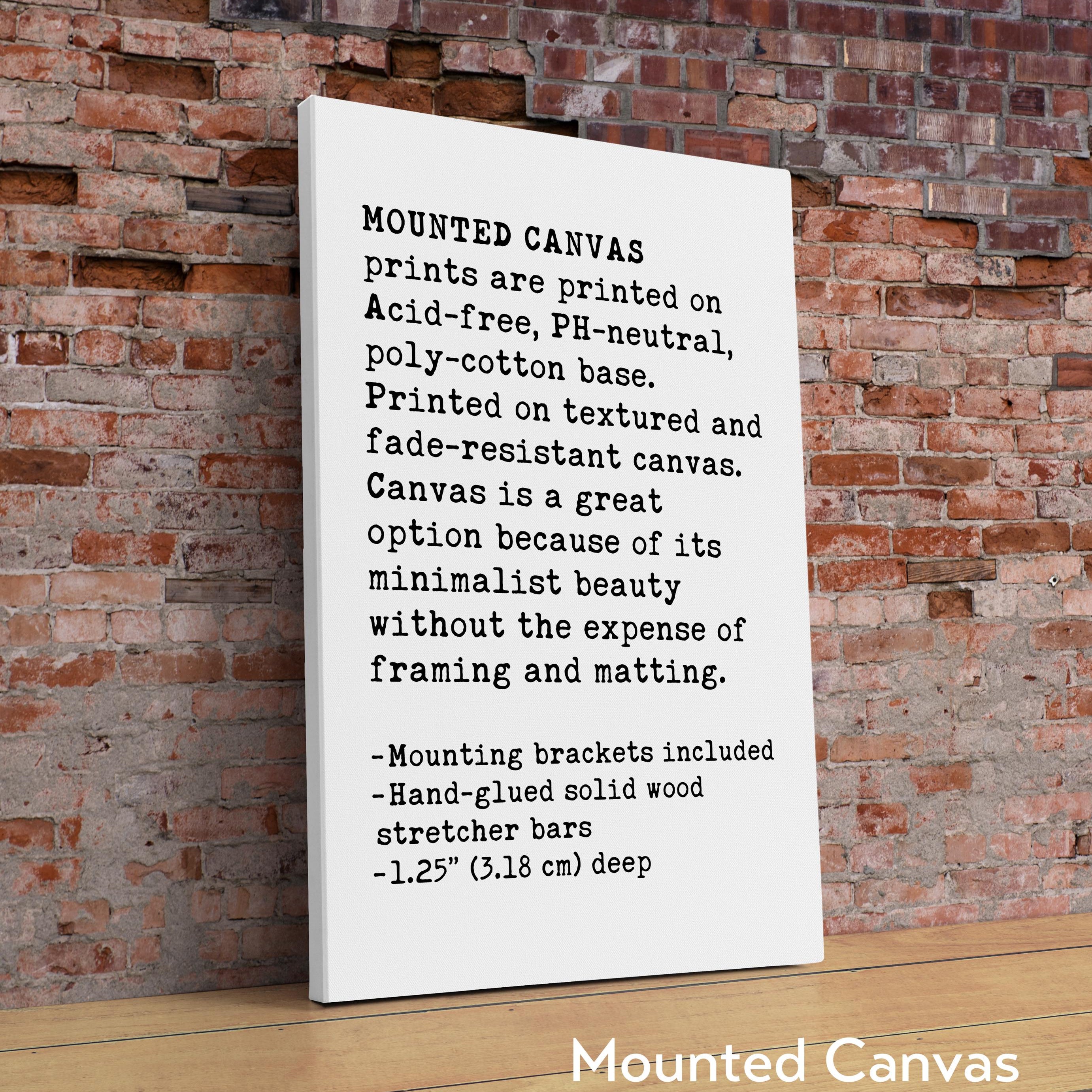 a sign on a table in front of a brick wall