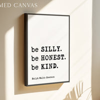 a framed poster with the quote "be SILY. be HONEST. be KIND." by Ralph Waldo Emerson.