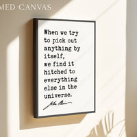 a framed canvas with a quote about finding oneself in the universe.