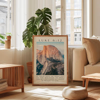 a framed poster of a mountain landscape, with a text overlay that reads " Luke 6:12" and "In these days he went out in the mountains to pray and he continued all night in prayer to God".
