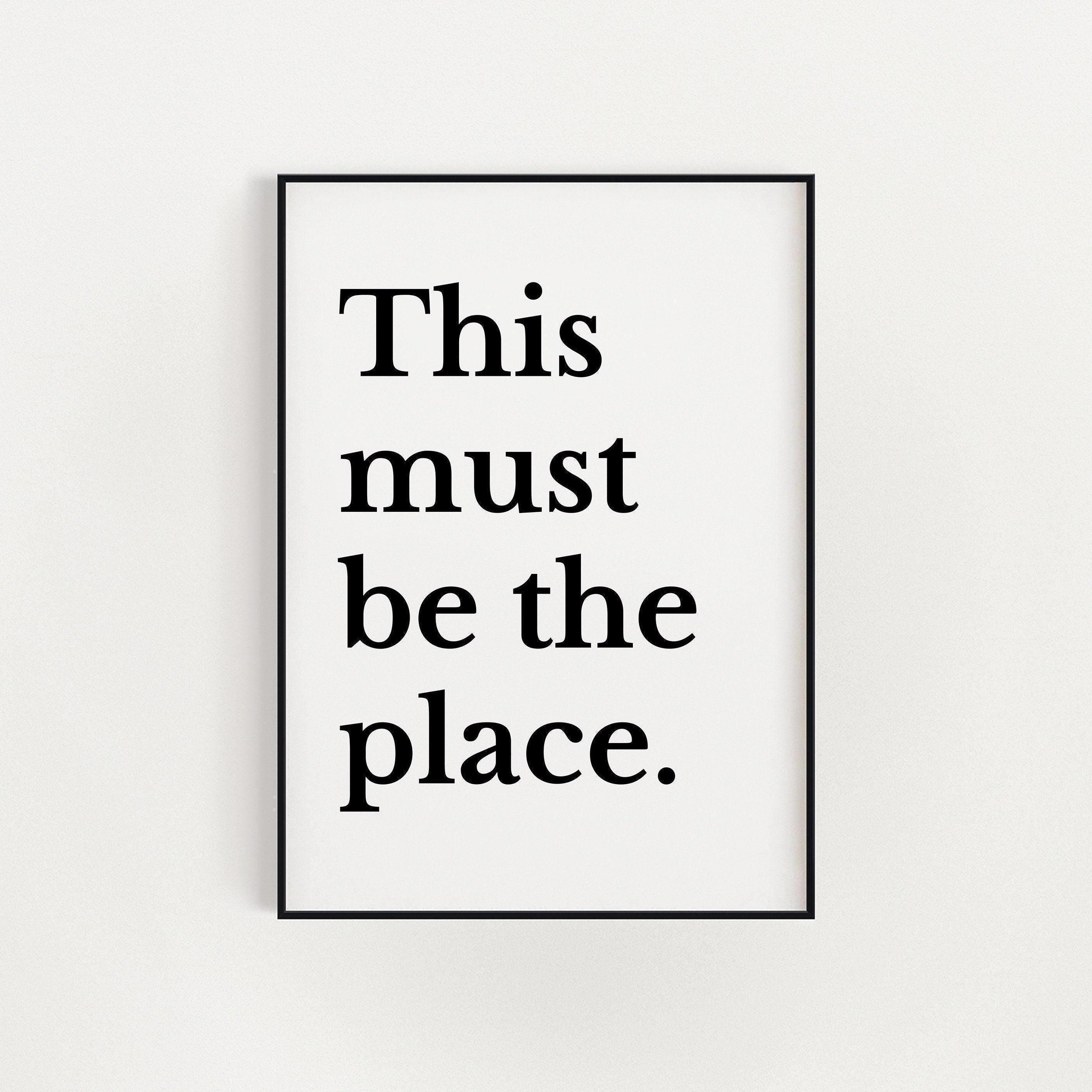 a framed text that reads "This must be the place."