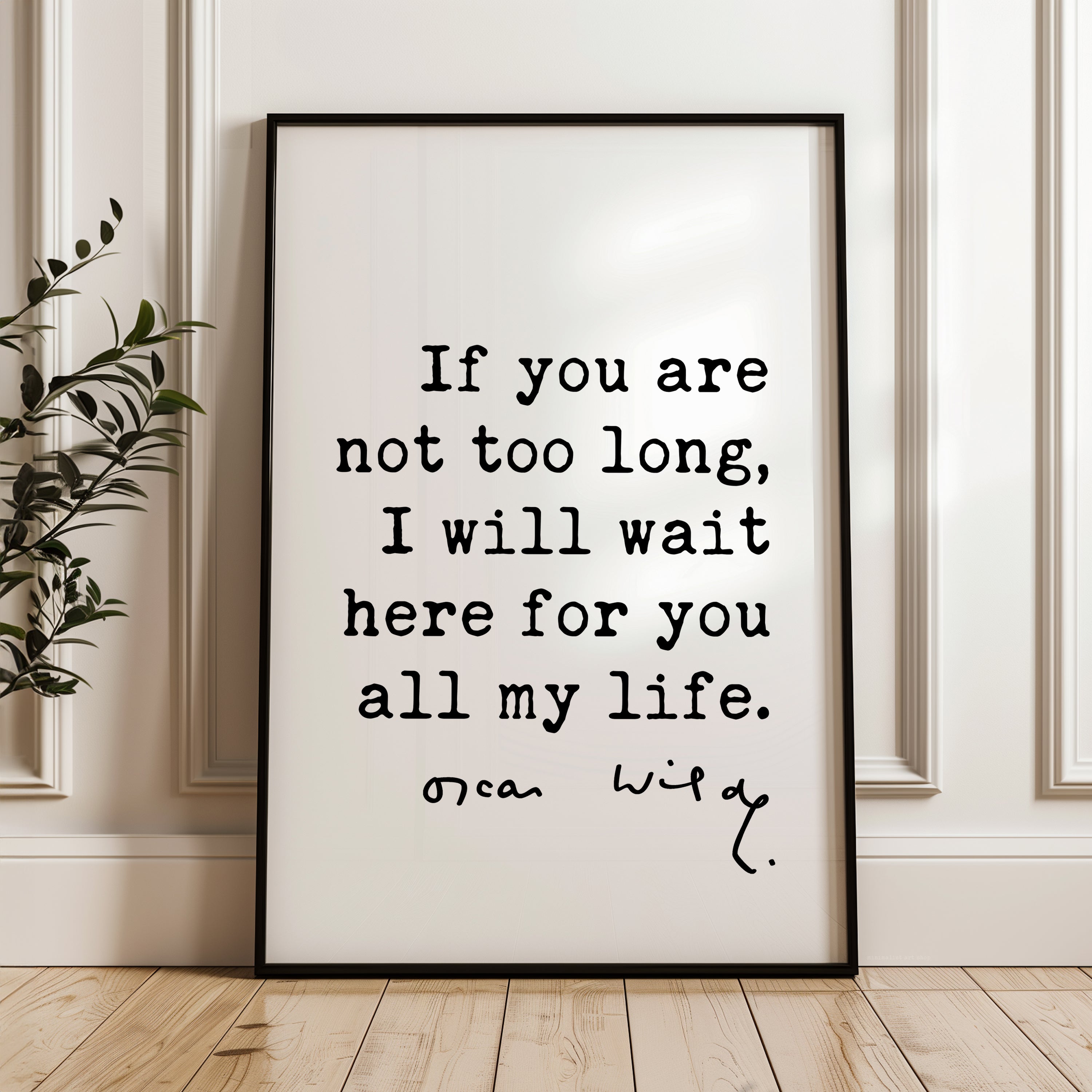 a framed quote by Oscar Wilde that reads, "If you are not too long, I will wait here for you all my life."