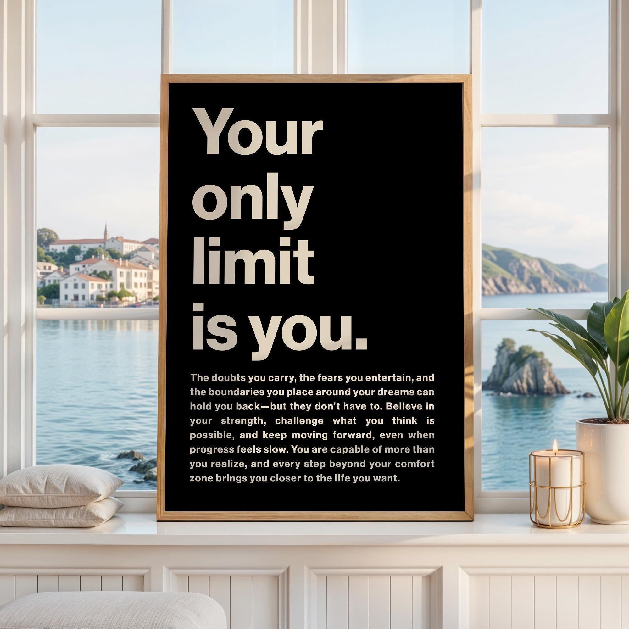 May include: A rectangular wall art print in a light wood frame featuring a black background with large, bold, cream-colored text that reads: Your only limit is you. Below this, a smaller paragraph of text provides an inspirational message.