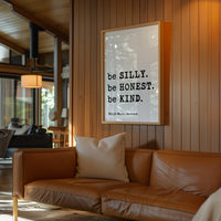 a cozy living room with a brown leather couch, a framed quote on the wall, and a wooden wall.