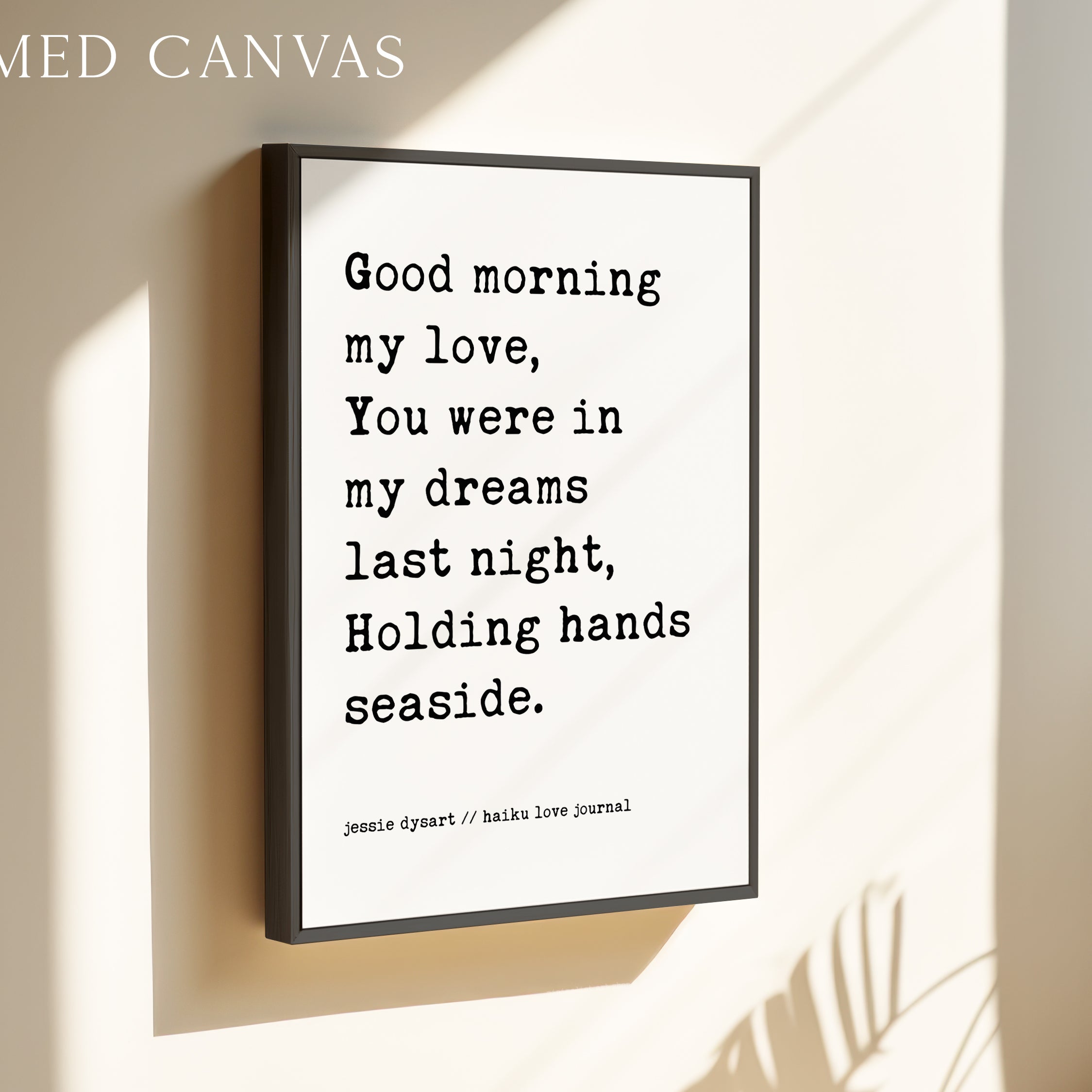 a framed canvas with a romantic message that reads: "Good morning my love, You were in my dreams last night, Holding hands seaside."