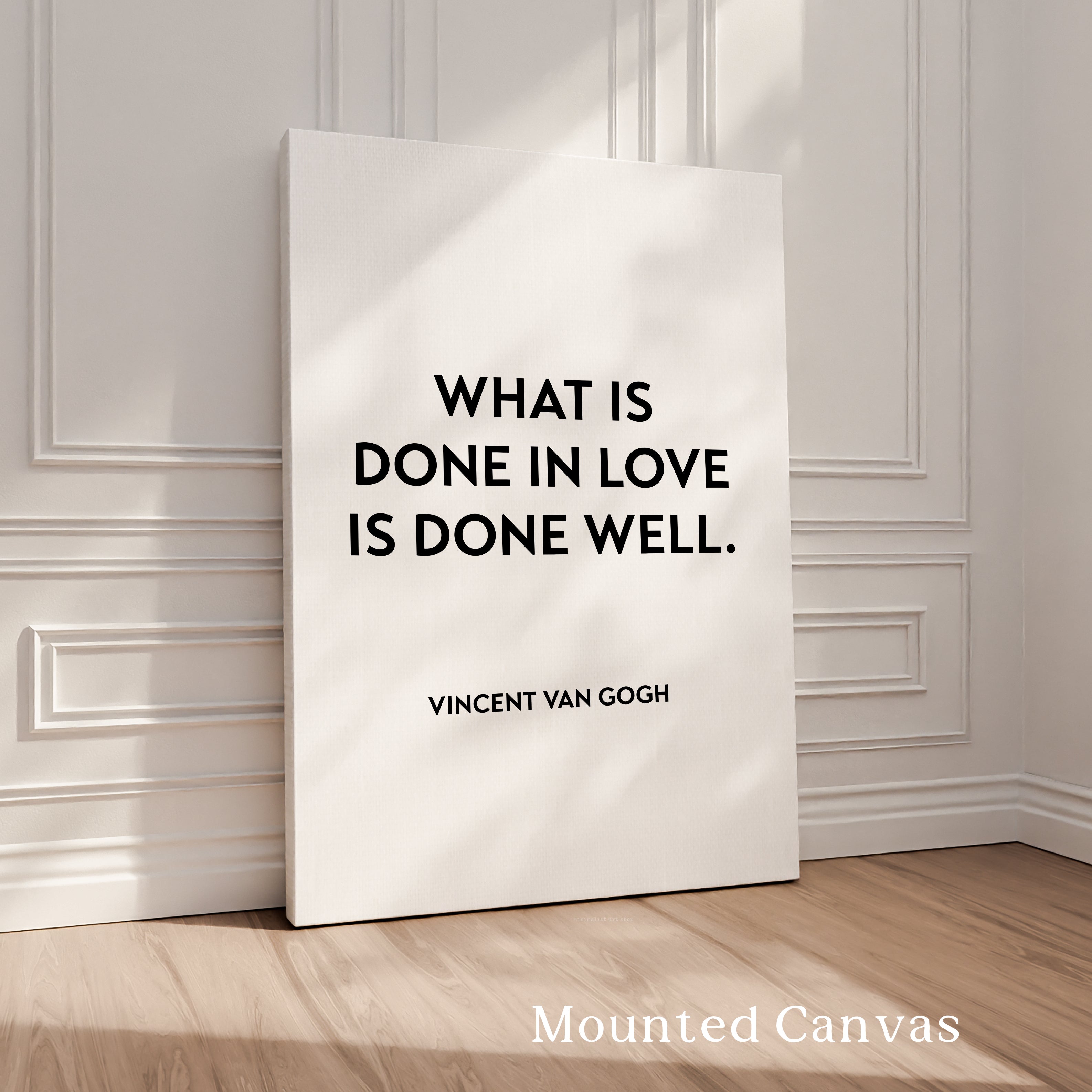 a quote by Vincent Van Gogh, "What is done in love is done well." The quote is displayed on a white canvas, which is propped up against a white wall. The image does not contain any additional text or details that would allow for a detailed description.