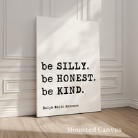 A white canvas with a quote by Ralph Waldo Emerson, "be SILLY. be Honest. be KIND.", displayed on it.