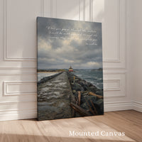 a painting of a man sitting on a wall next to the ocean