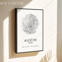 a framed canvas depicting a map of Austin, Texas, with the city's location and compass directions provided.