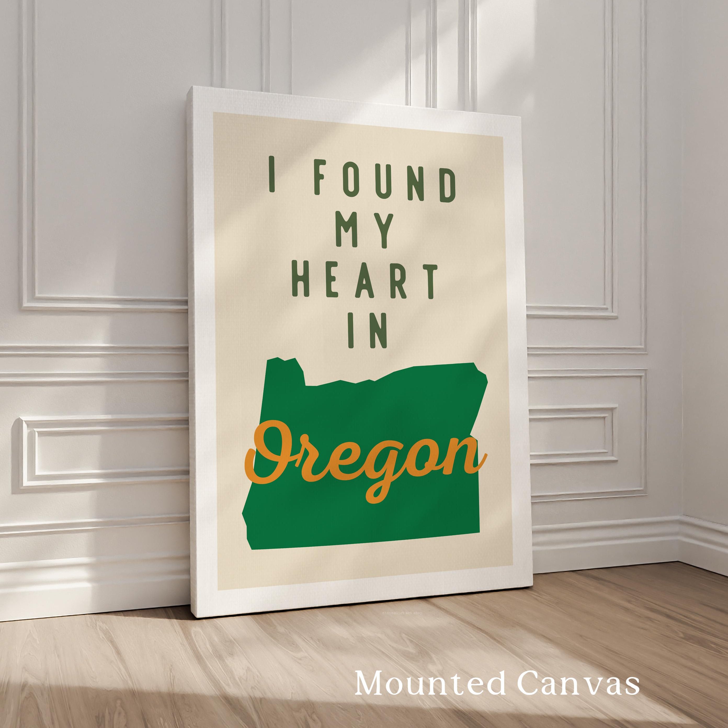 A framed poster with the text "I FOUND MY HEART IN OREGON" and a graphic of the state of Oregon.