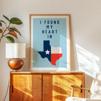 a framed poster of the state of Texas with the text "I FOUND MY HEART IN" displayed on it.