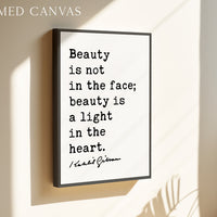 a framed quote on a wall that reads "Beauty is not in the face; beauty is a light in the heart."