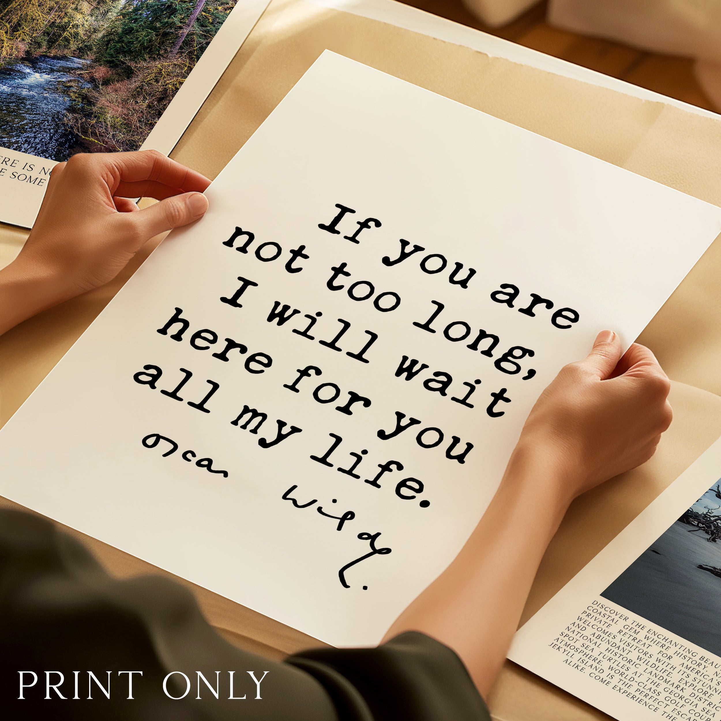 A person's hands holding a piece of paper with a handwritten message on it.
