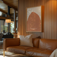 a cozy living room with a brown leather sofa, a framed picture of a mountain, and a wooden wall.