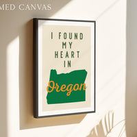 a framed poster with the text "I FOUND MY HEART IN OREGON" and a graphic of the state of Oregon.