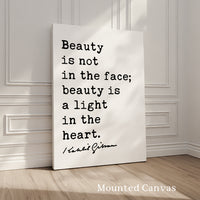 A white canvas with a quote by Rabbi Sacks about beauty being a light in the heart.