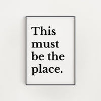 a framed text that reads "This must be the place."