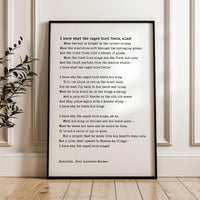 The image is a framed poem titled "I know what the caged bird feels like" by Paul Laurence Dunbar. The poem is written in a sonnet form and features a list of reasons why the caged bird feels trapped, including the bird's inability to fly freely, the bird's longing for the open sky, and the bird's desire to spread its wings and soar.