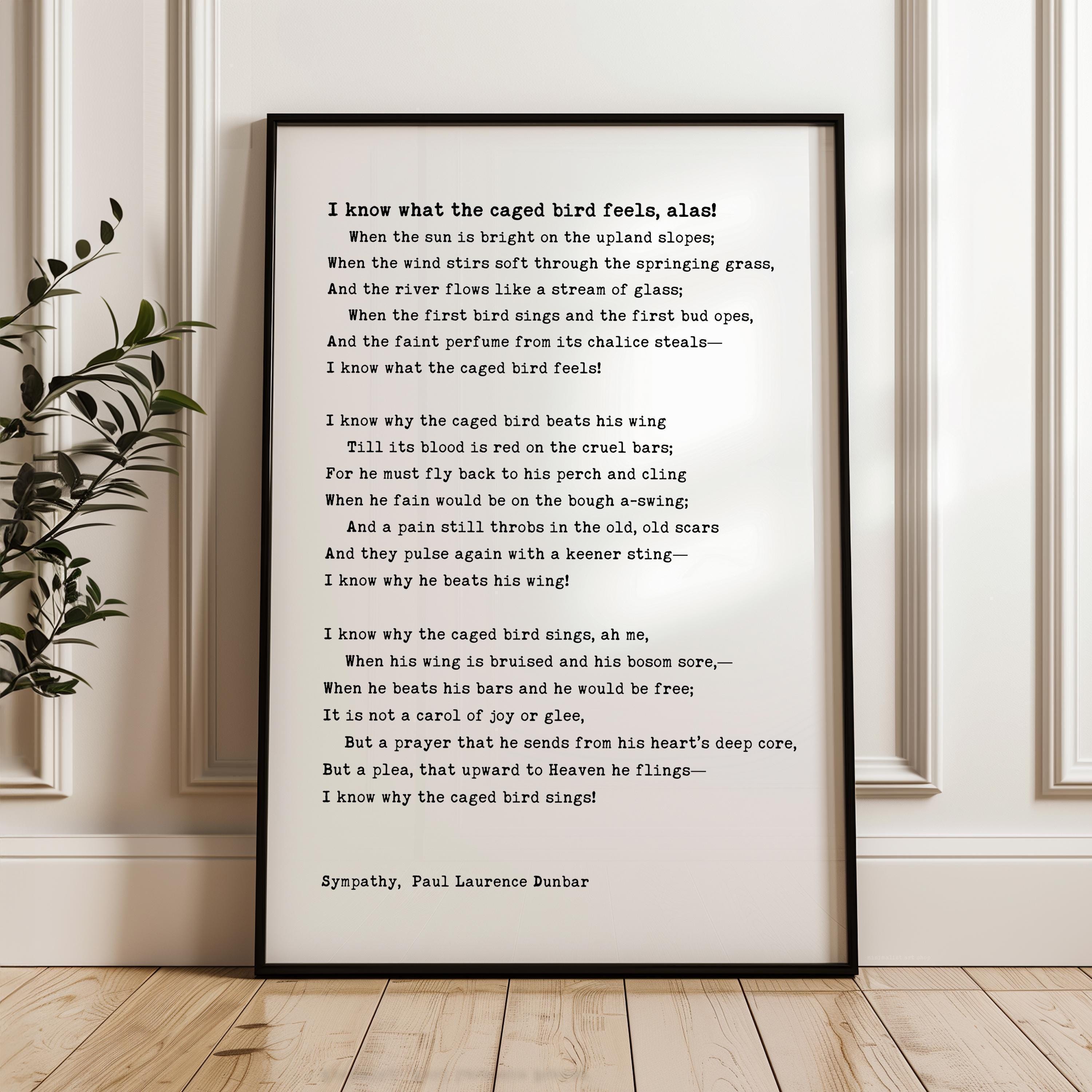 The image is a framed poem titled "I know what the caged bird feels like" by Paul Laurence Dunbar. The poem is written in a sonnet form and features a list of reasons why the caged bird feels trapped, including the bird's inability to fly freely, the bird's longing for the open sky, and the bird's desire to spread its wings and soar.