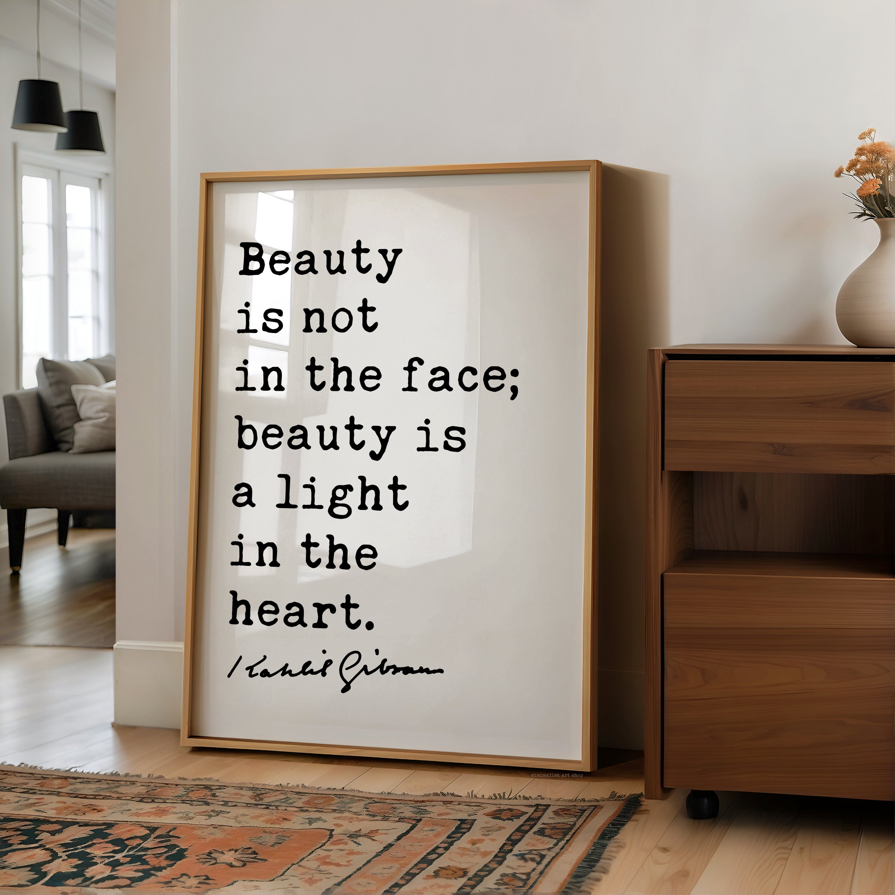 A framed quote by Tara St. James Gibran stating "Beauty is not in the face; beauty is a light in the heart."