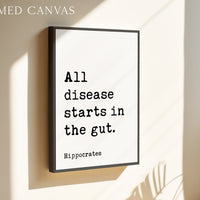 a framed canvas with the text "All disease starts in the gut" and the name "Hippocrates" below it.
