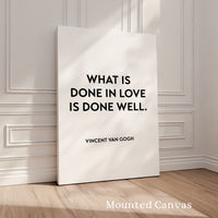 a quote by Vincent Van Gogh, "What is done in love is done well." The quote is displayed on a white canvas, which is propped up against a white wall. The image does not contain any additional text or details that would allow for a detailed description.