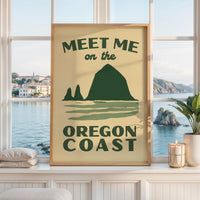 May include: A rectangular wall art print with a light beige background featuring dark green text that reads MEET ME on the OREGON COAST. The design includes a dark green graphic of a large coastal rock formation above stylized water waves.