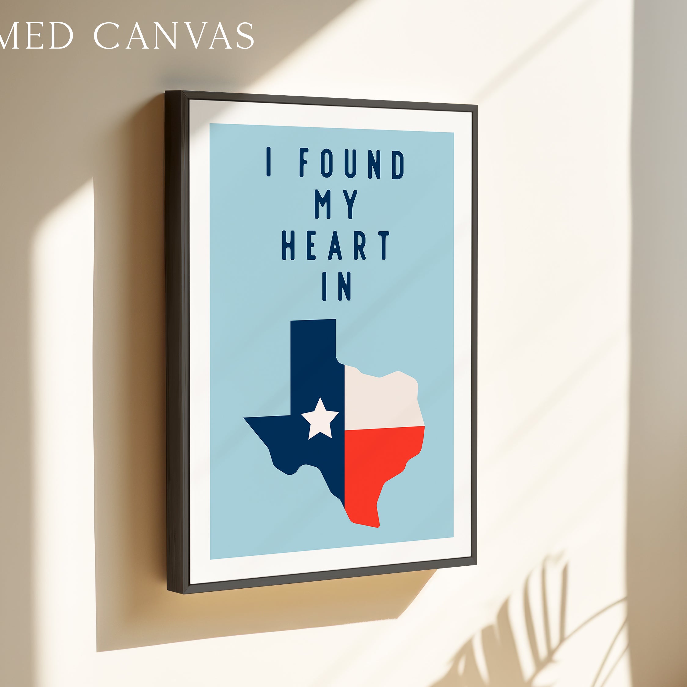 a framed poster with a Texas state map and the text "I FOUND MY HEART IN" displayed on it.
