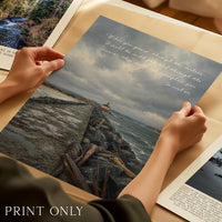 a person is holding a picture of a beach