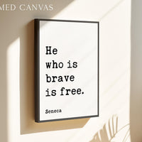 a framed poster with the text "He who is brave is free." attributed to Seneca.
