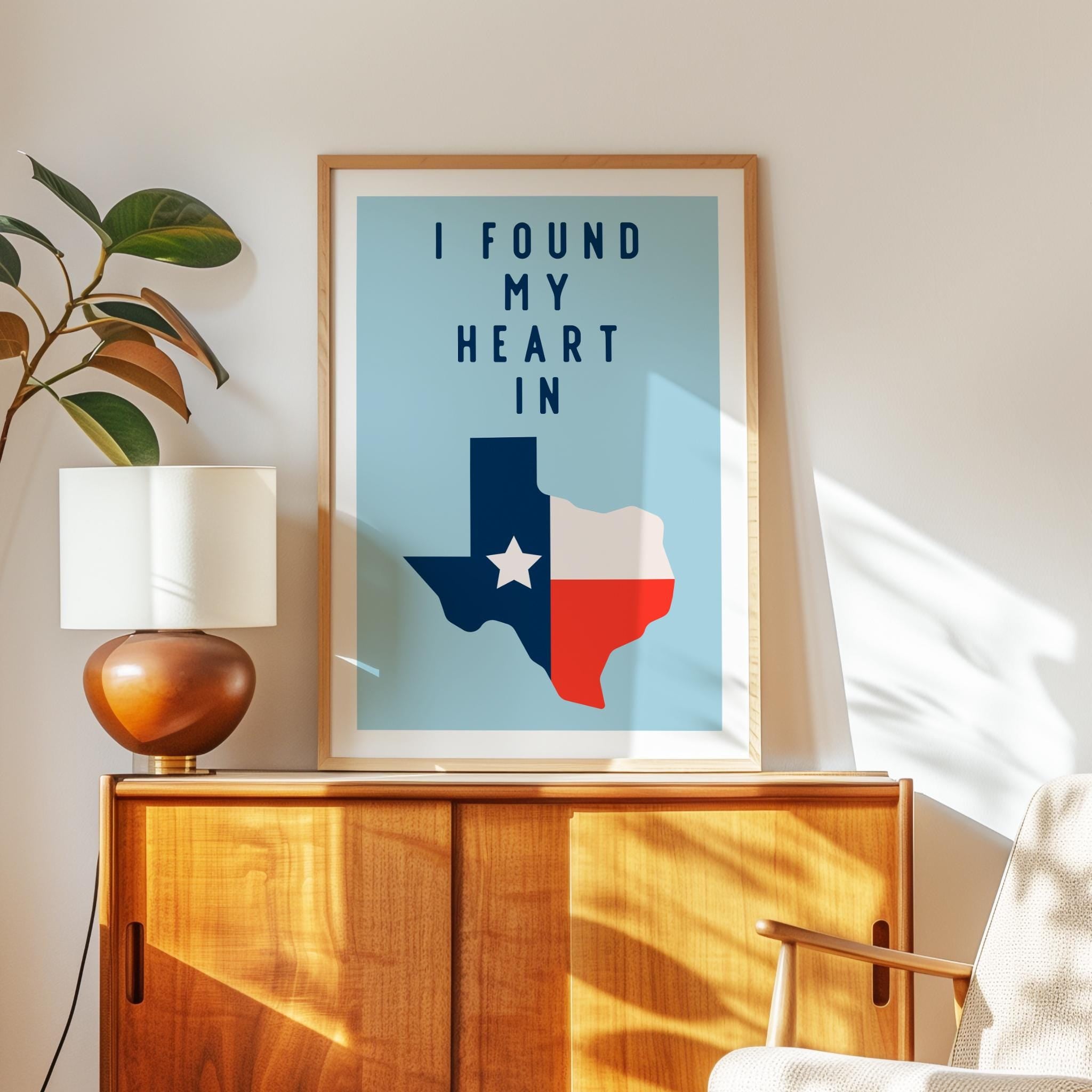 a framed poster of the state of Texas with the text "I FOUND MY HEART IN" displayed on it.