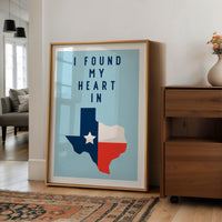 a framed poster with a Texas state map and the text "I FOUND MY HEART IN" displayed on it.