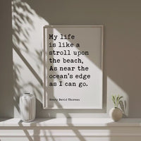 My life is like a stroll upon the beach, As near the ocean's edge as I can go. • Henry David Thoreau Quote • Typography Art Print